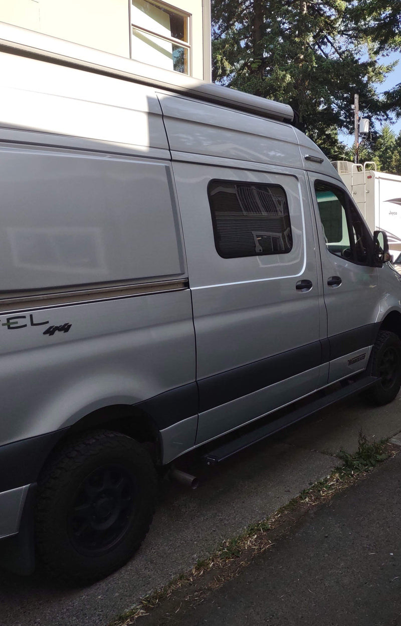 Silver Winnebago Revel 4x4 camper van, perfect for your next rv rental trip. Features awning & all-terrain tires. — photo 9