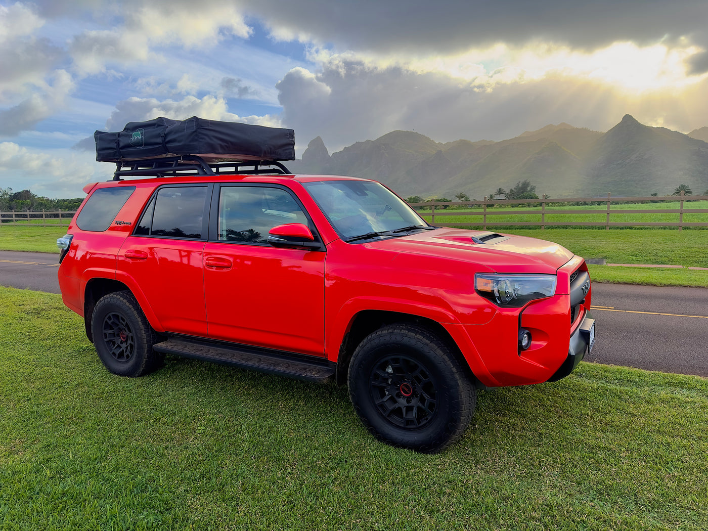 Bright red Toyota 4Runner with rooftop tent, ideal for overland adventures or as an RV rental alternative in the mountains. — photo 6