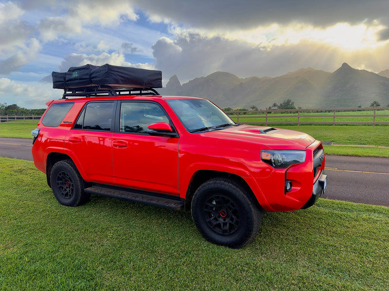 Bright red Toyota 4Runner with rooftop tent, ideal for overland adventures or as an RV rental alternative in the mountains. — photo 6