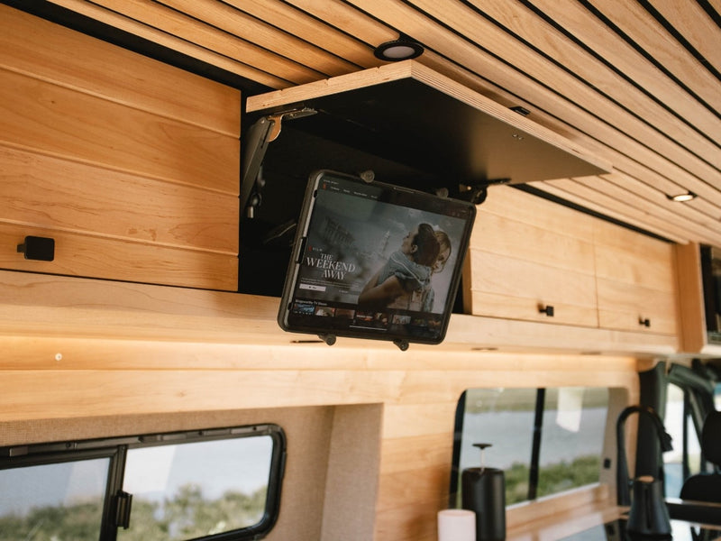  and outdoor speaker under a blue sky.|Explore with this RV rental! Rear view of a camper van with open doors — photo 14