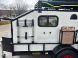 Big Bubba's teardrop trailer, equipped with a Road Shower, water jug, and ladder. Ideal for RV rental adventures.
