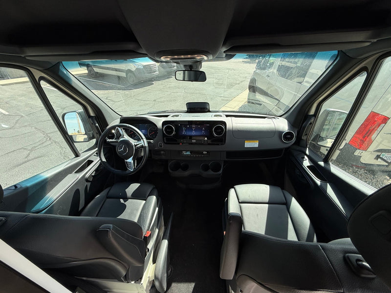  parked on gravel. Ideal for adventure.|Rear view of this rv rental van shows its custom VANCRAFT interior through open doors: bed — photo 5