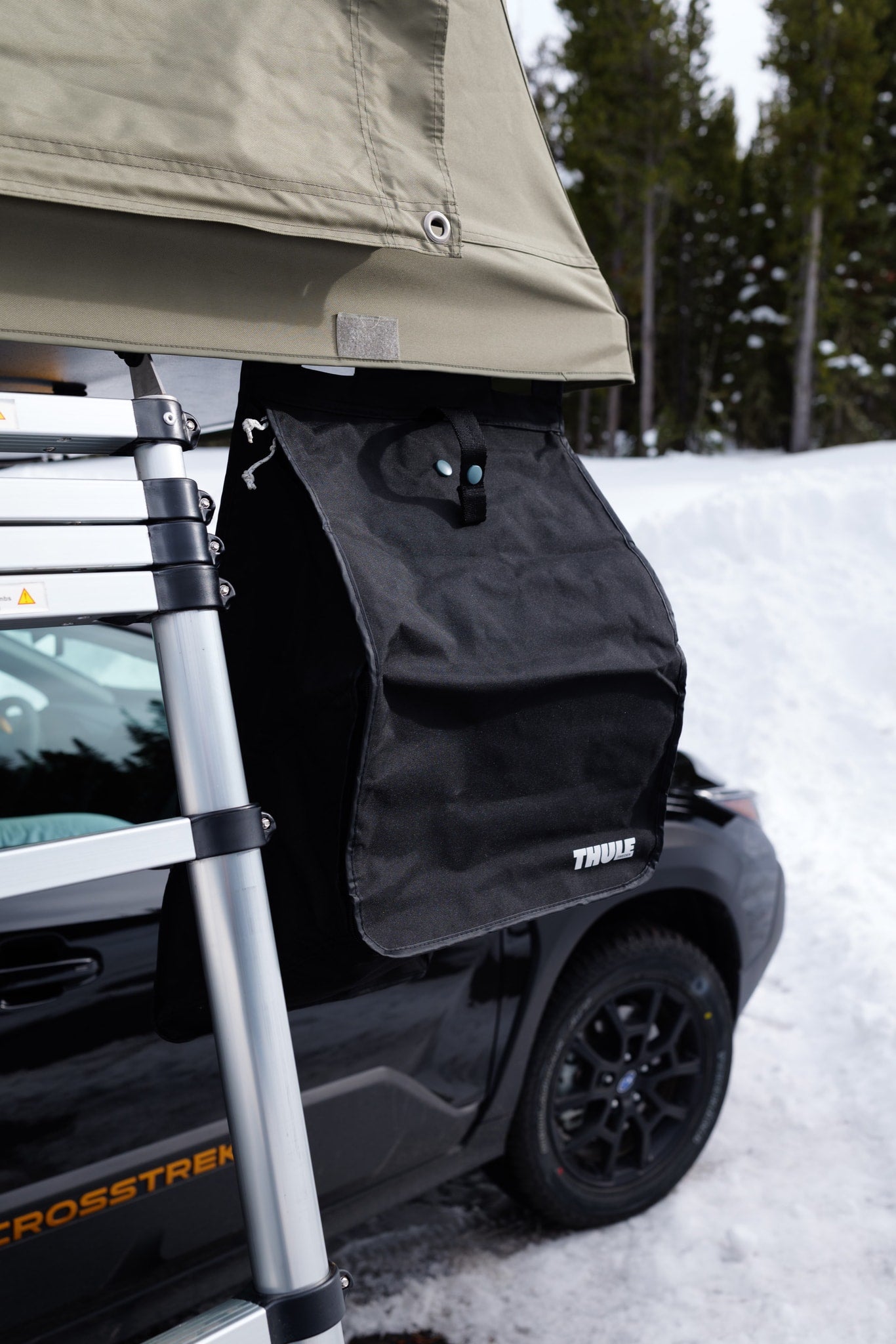 A Subaru Crosstrek with a Thule rooftop tent, ladder, and gear bag, ideal for RV rental wilderness trips. — photo 7