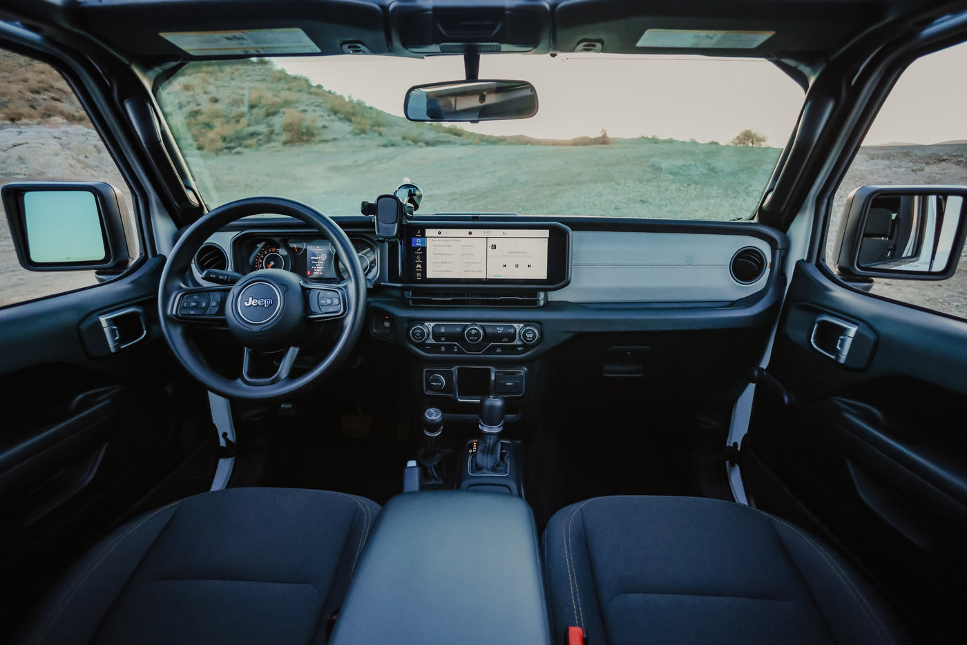 Inside a modern Jeep. Dashboard view for your RV rental, offering tech and rugged comfort for off-road travels. — photo 17
