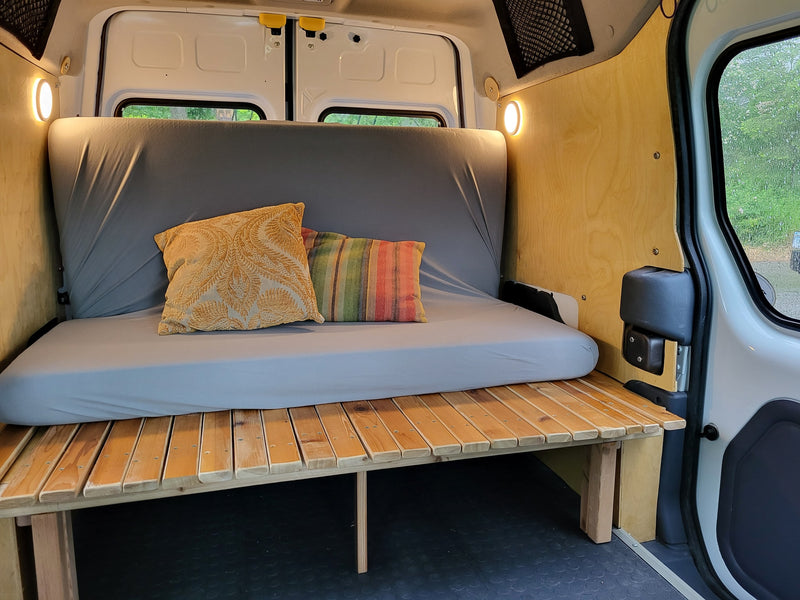  overlooking lush greenery through the back windows.|Interior of an RV rental — photo 8