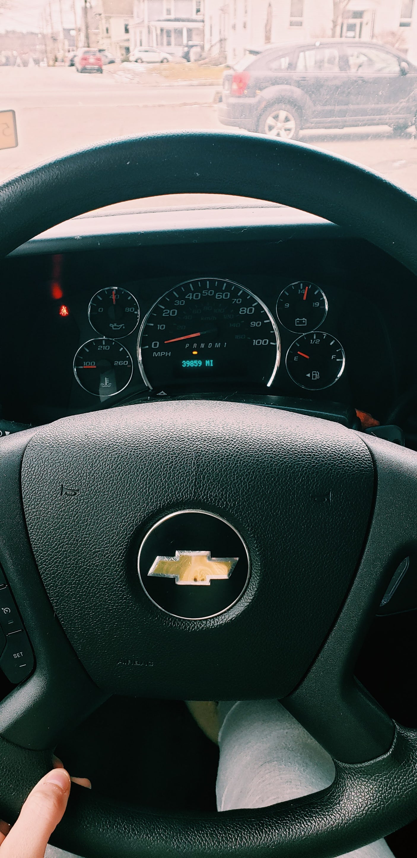 View from an RV rental driver's seat, featuring a Chevrolet steering wheel and dashboard showing 39,859 miles.