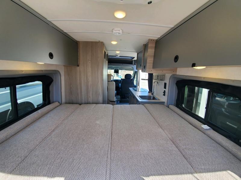  ready for adventure.|Rugged BFGoodrich All-Terrain KO2 tire & black XD wheel. Ideal for an RV rental adventure!|Inside an RV rental: Comfortable black & gray front seats with armrests — photo 13