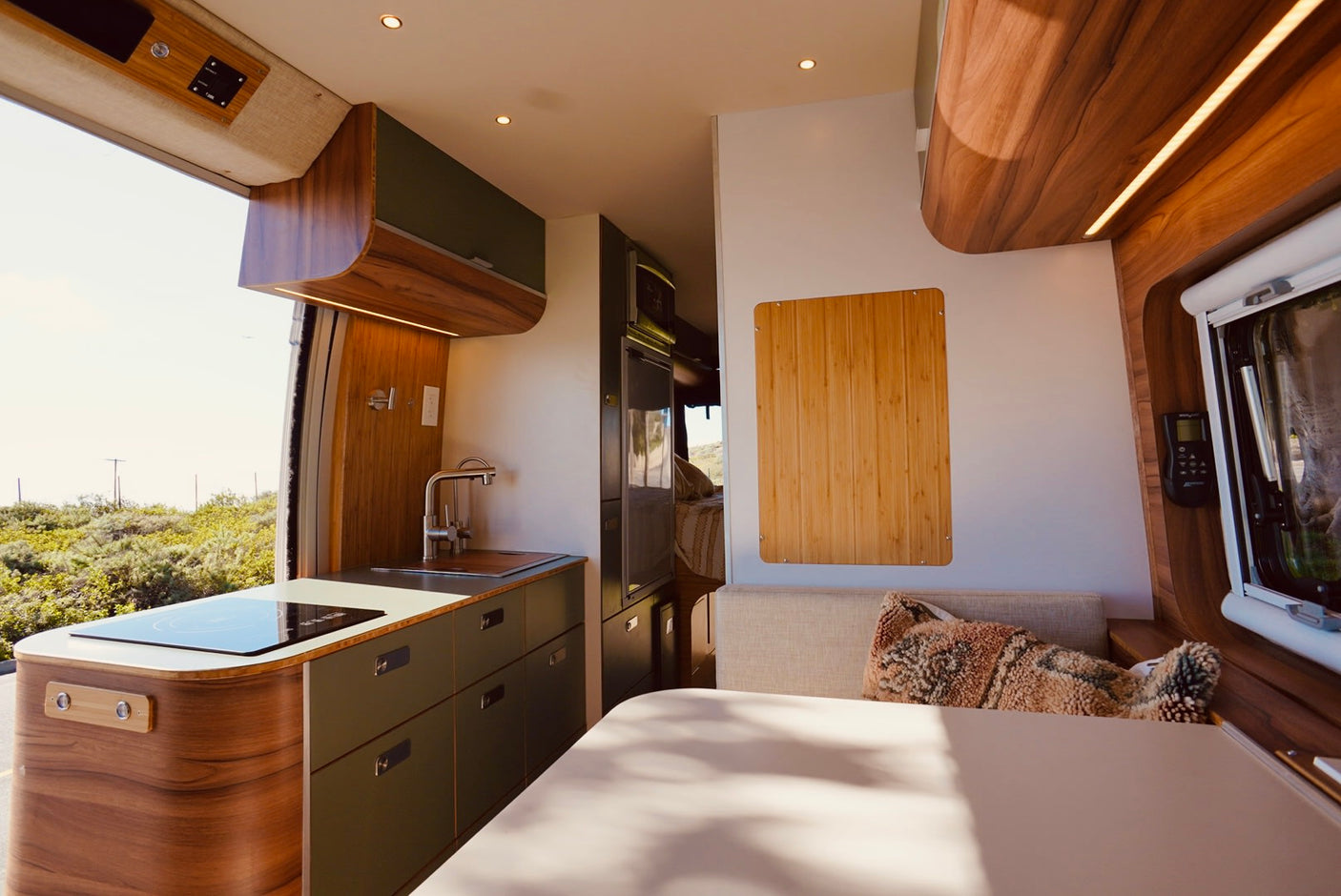 Step inside this modern RV rental! Features a sleek kitchen, cozy living space, and stunning views for your adventure.