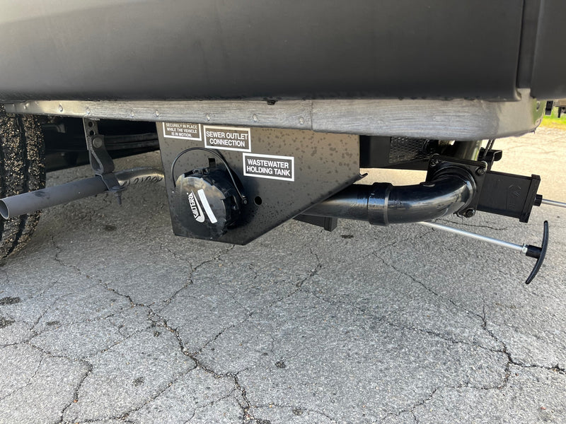 Essential RV rental feature: a Valterra wastewater holding tank and sewer outlet connection for proper waste disposal. — photo 9