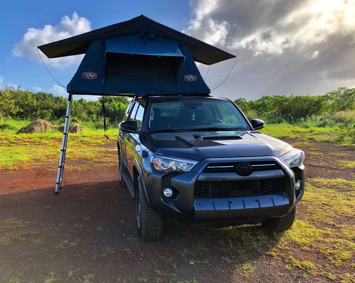 This dark SUV with a Tepui rooftop tent, perfect for an RV rental adventure, set up in a scenic outdoor landscape. — photo 9