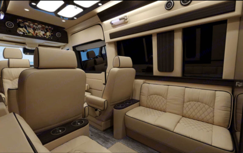  and a mounted TV.|Spacious luxury RV rental interior with plush cream-colored — photo 15