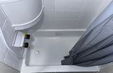 This RV rental offers a compact, clean white shower with visible controls and a practical gray shower curtain.
