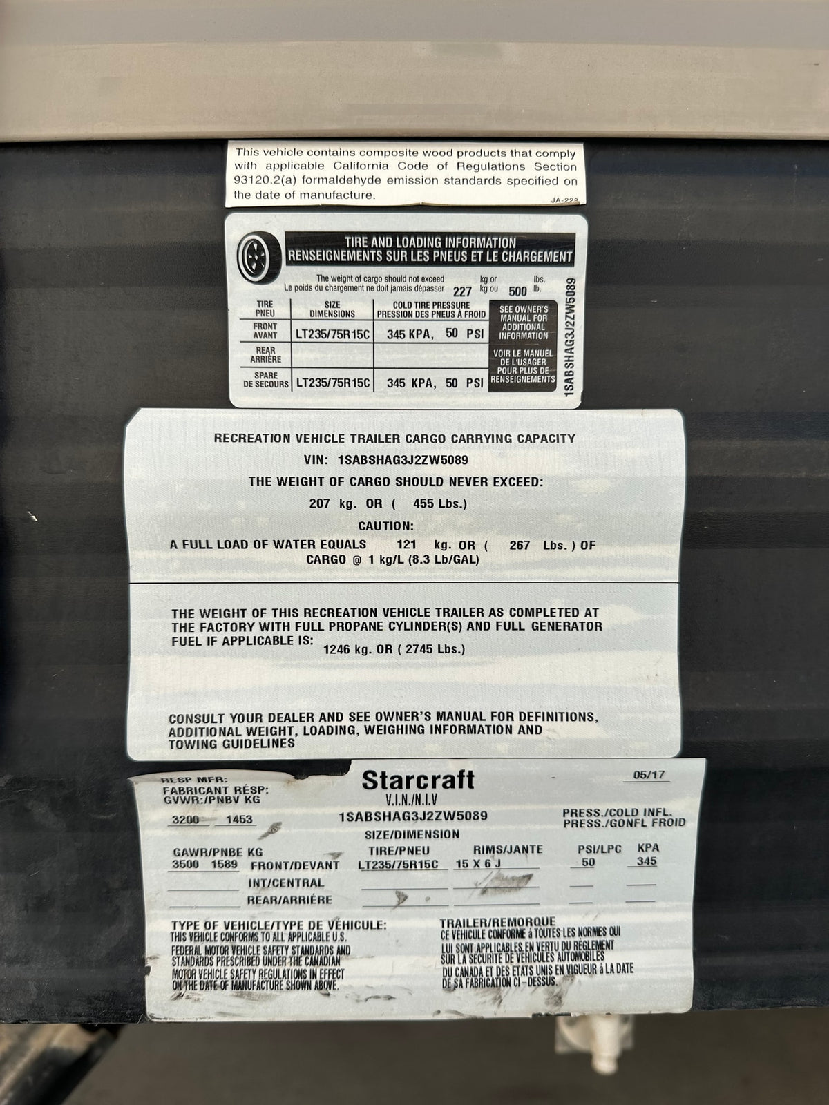 Starcraft RV rental trailer safety label: VIN, tire pressure, and weight specifications. Crucial info for safe operation. — photo 13