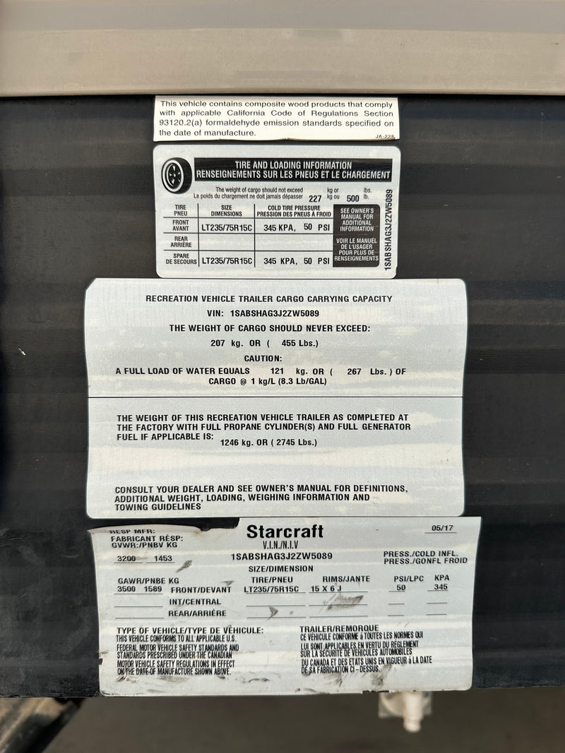 Starcraft RV rental trailer safety label: VIN, tire pressure, and weight specifications. Crucial info for safe operation. — photo 13