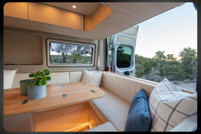  and glimpse of bathroom & bed. Bright and functional space.|Explore a sleek rv rental interior: kitchen — photo 9