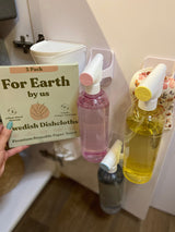 Sustainable Blueland cleaning bottles & Swedish dishcloths perfect for a compact RV rental kitchen setup.