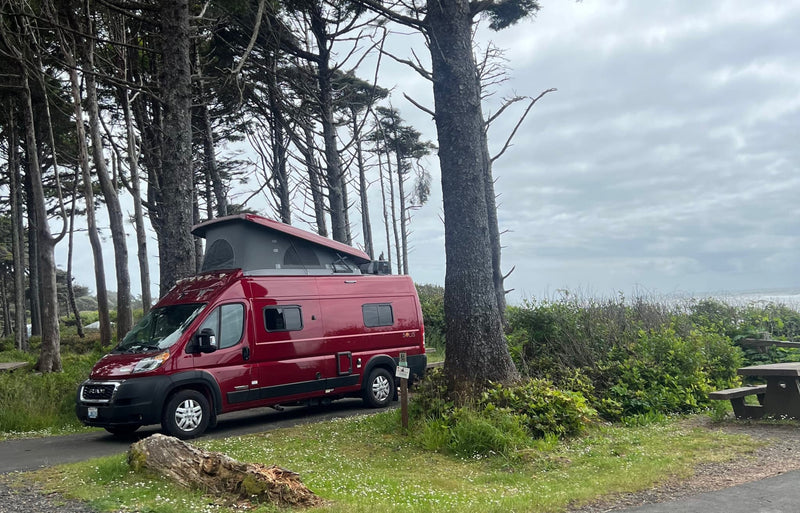 Red Winnebago Solis camper van (RV rental) with raised pop-top — photo 1