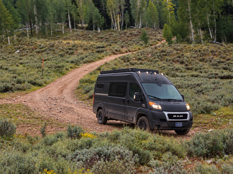  and a scenic window view.|Experience freedom in this rv rental. Modern campervan interior features a sleek kitchen — photo 16