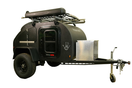 Black Oregon TrailR DoDrop ALPHA off-road teardrop camper, ideal for RV rental. Rugged trailer with roof rack & toolbox.