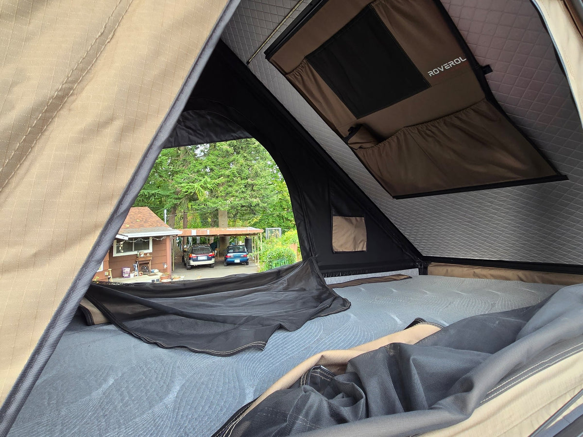  and a ROVEROLL rooftop tent.|Inside a Roverol rooftop tent — photo 3