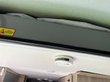 RV rental interior with pop-top fabric, a "ADULT SUPERVISION REQUIRED" warning, and a smoke detector on the ceiling.