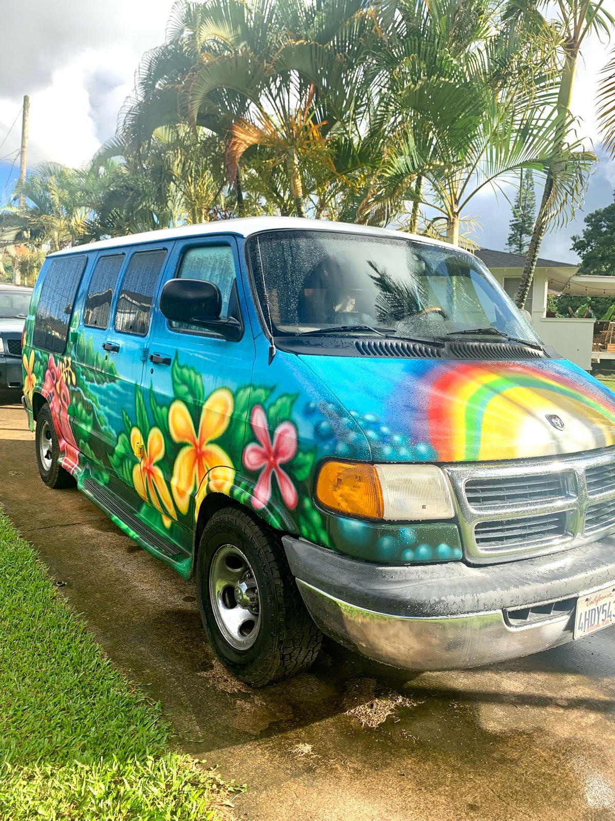  and flowing blue waters.|Eye-catching RV rental: a custom-painted blue Ram 1500 van featuring a vibrant surf and wave mural on its rear.|Unique turquoise RV rental features a vivid custom airbrush mural: a sea turtle in an ocean scene.|RV rental ready: clear bin packed with camping kitchen cookware — photo 11