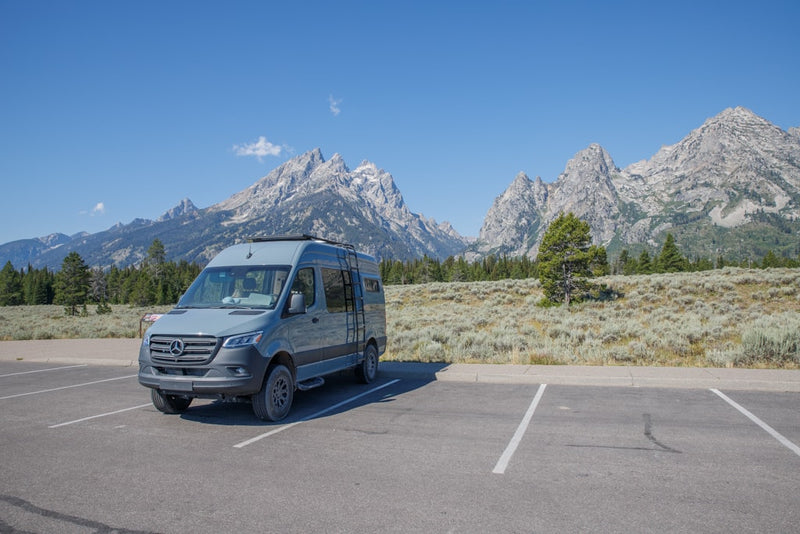  featuring a ladder and bike rack.|A grey RV rental van — photo 7
