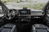 Inside this premium rv rental: a modern Mercedes-Benz cockpit with large display, comfortable leather seats, and practical storage.
