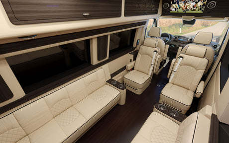 Experience a spacious luxury RV rental interior: cream leather seats, TV, dark wood, and plush comfort for travel.