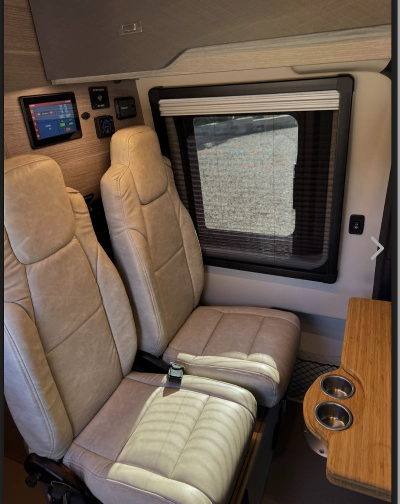  and roof rack.|Inside an RV rental: open door reveals the driver's seat — photo 6