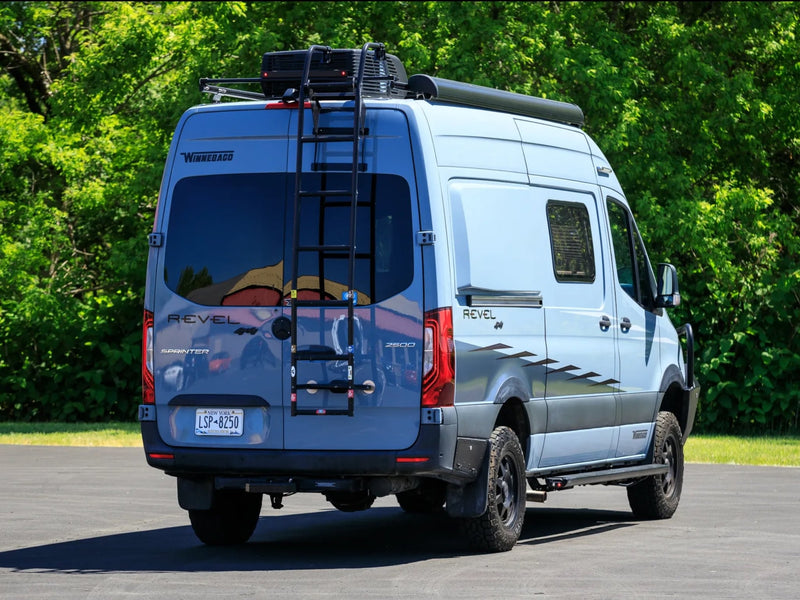  lush trees.|RV rental camper van parked at a scenic red rock national park overlook under a clear blue sky — photo 4