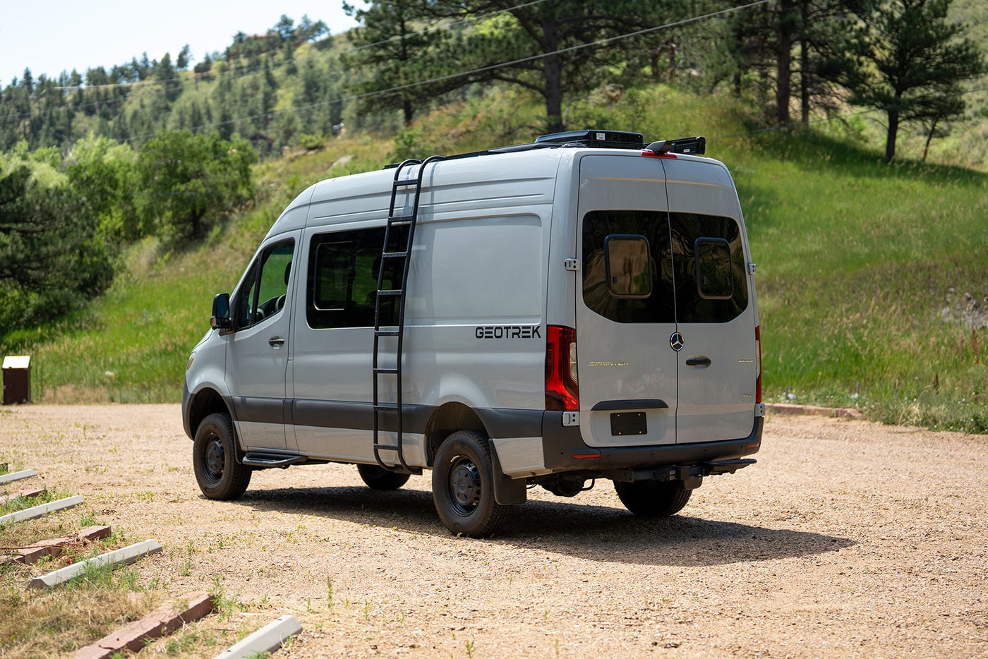 Explore nature with this custom Mercedes Sprinter rv rental. Grey camper van with roof ladder, ideal for off-grid adventures. — photo 16