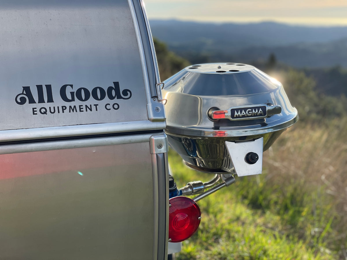 Grill attached to an All Good Equipment Co. RV rental. This Magma grill is ready for outdoor cooking amidst scenic hills. — photo 4