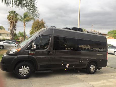 Dark grey Sequence Ram ProMaster camper van, a perfect RV rental for your next road trip adventure.