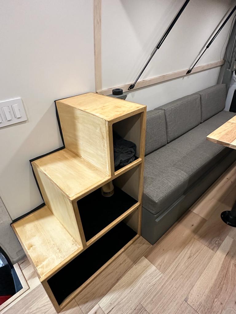  and front seats. Ready for travel.|Cozy RV rental interior with a long wooden table — photo 3