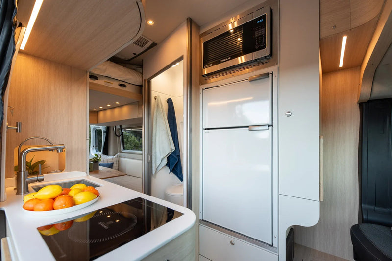  and nature views. Perfect for travel adventures.|Modern RV rental interior with a comfortable dining/lounge area — photo 5