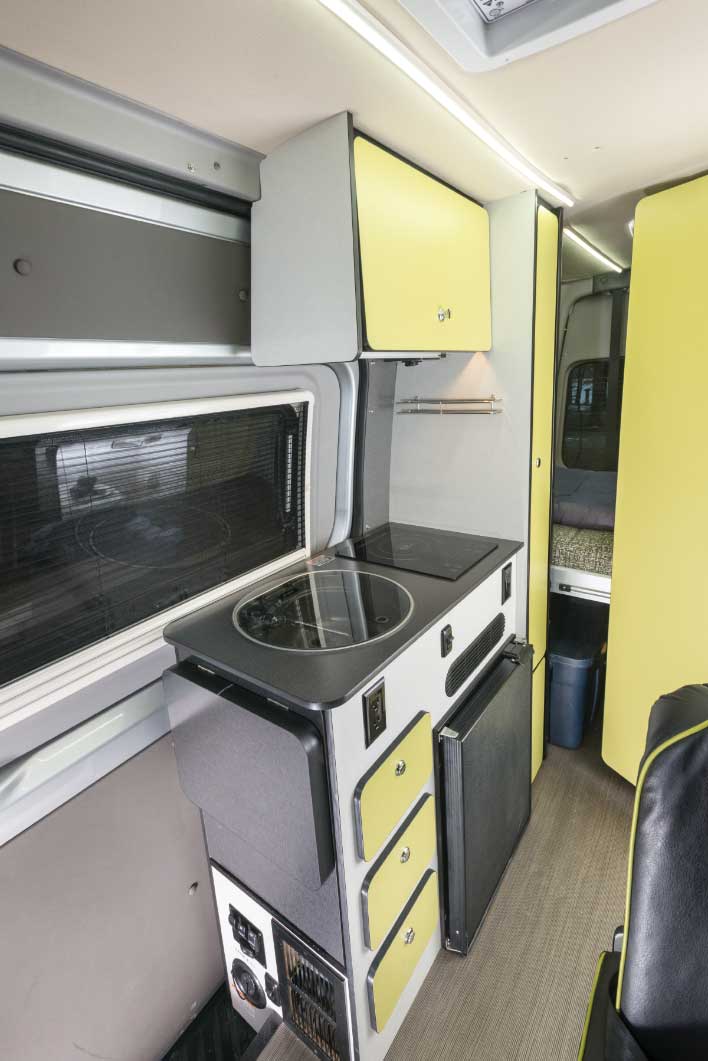 & toilet in this camper van layout.|Cozy **RV rental** interior: a bright bedroom area with a white mattress — photo 2