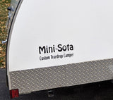 White "Mini-Sota Custom Teardrop Camper" RV rental, showing the decal and lower diamond plate trim.
