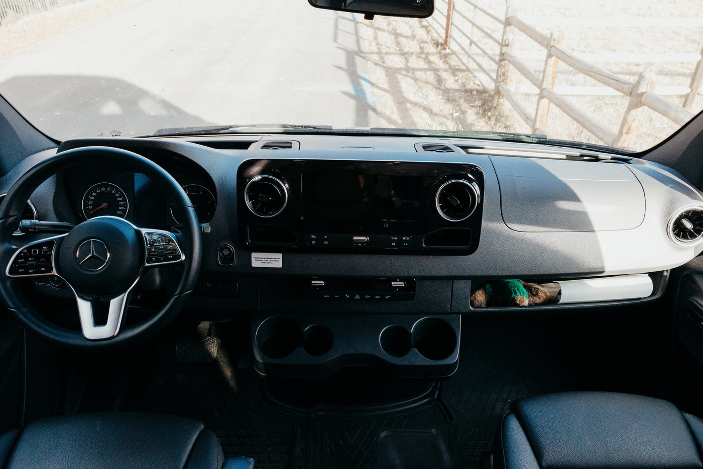  and system controls.|Plush bed inside a stylish RV rental — photo 14