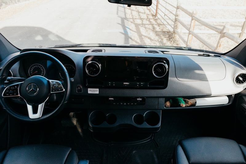  and system controls.|Plush bed inside a stylish RV rental — photo 14