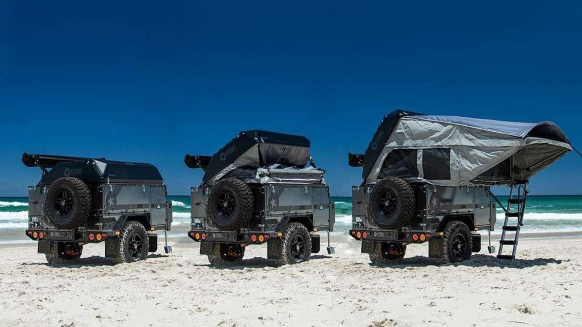  perfect for an RV rental adventure. Outdoor glamping with storage and BBQ.|RV rental interior shows two lime green cots in a grey tent-like camper — photo 6