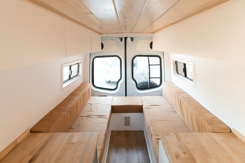  bright camper van interior showcasing a kitchenette with wood counters — photo 4