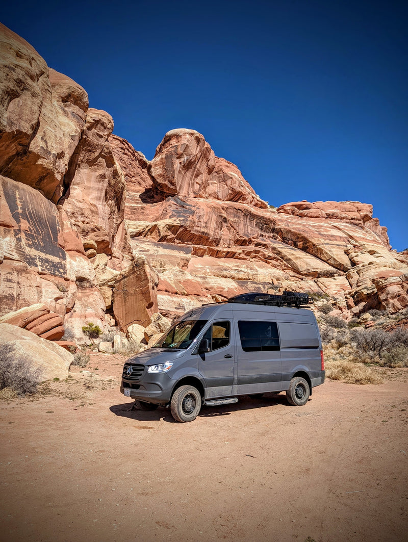  ample gear storage for snowboards & boots. Ready for adventure travel.|This RV rental van interior features flexible seating — photo 19