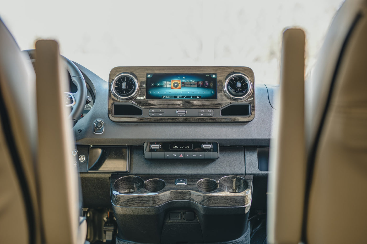  and modern lighting for ultimate comfort.|Premium rv rental interior: cream leather seats — photo 11