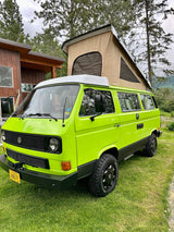 Bright lime green VW Vanagon pop-top camper, ready for an Alaskan outdoor rv rental adventure.
