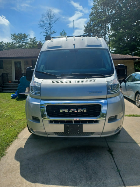 Front view of a light gray Winnebago ProMaster van, ready for your next rv rental adventure.