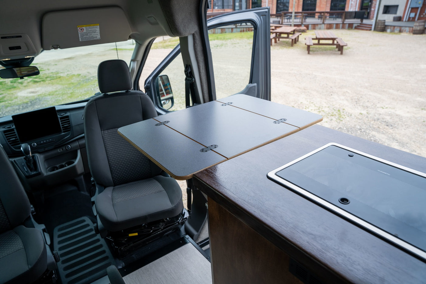  awaits your adventure.|This rugged dark gray RV rental van is equipped with a roof rack — photo 19