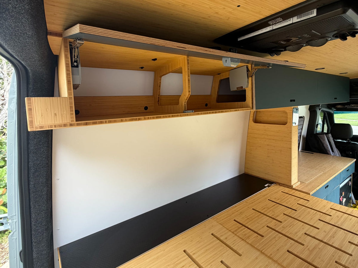  ample storage for surfboards and adventure gear.|Sleek bamboo interior of an rv rental van — photo 8