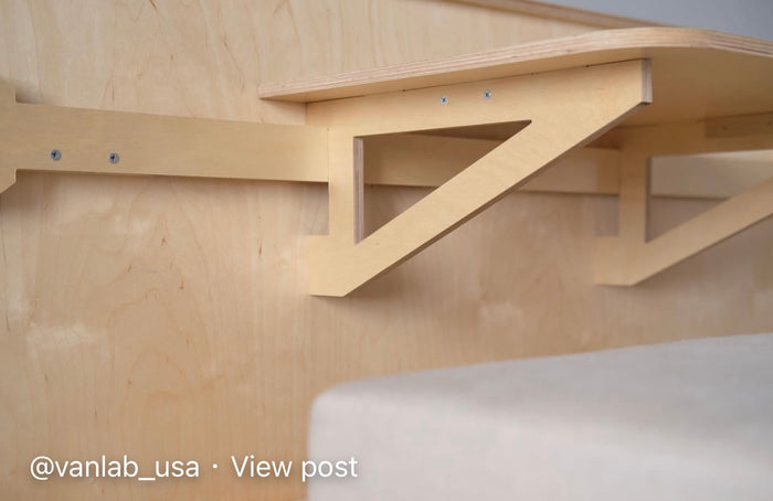  and seat back organizers.|Inside a modern van conversion: modular plywood setup with sink