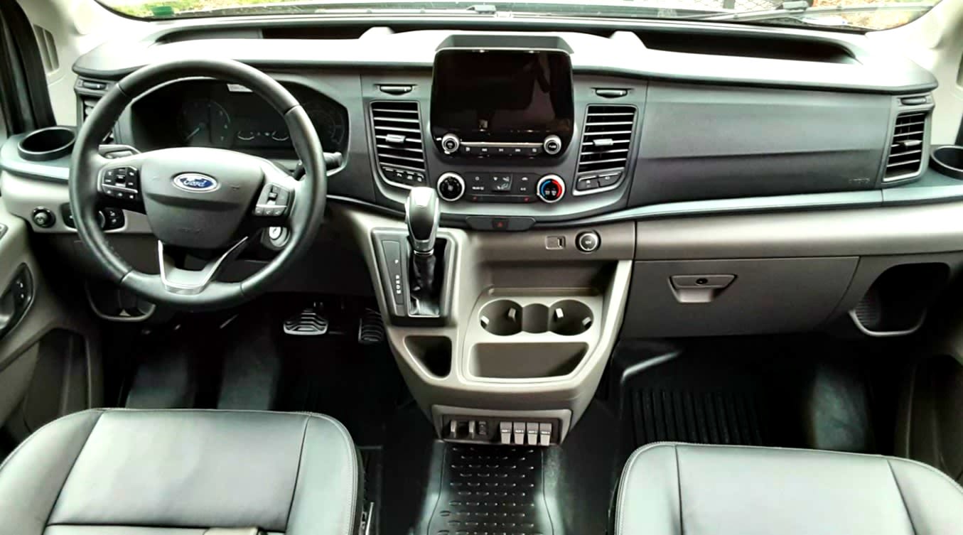  essential for fresh food on your road trip or camping adventures.|RV rental interior showing a modern Ford van dashboard with touchscreen — photo 2